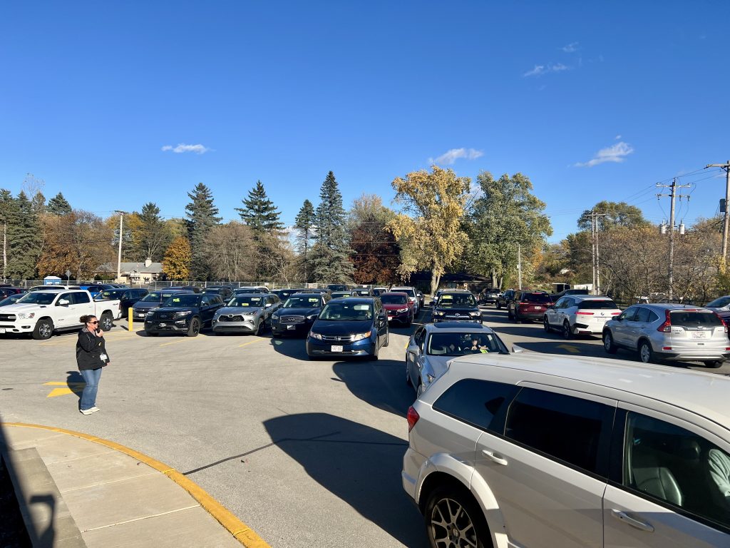 cars lined up waiting outside of school
