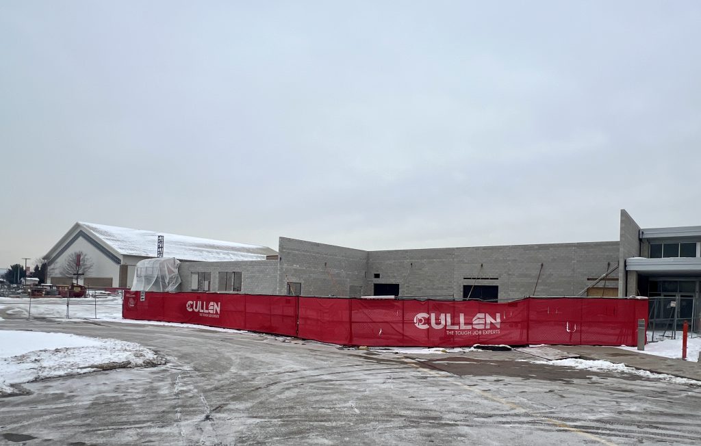 outside incomplete cafeteria in the winter. initial wall structure visible. Feb. 14, 2025.