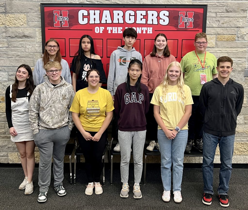 11 students of the month smiling at camera