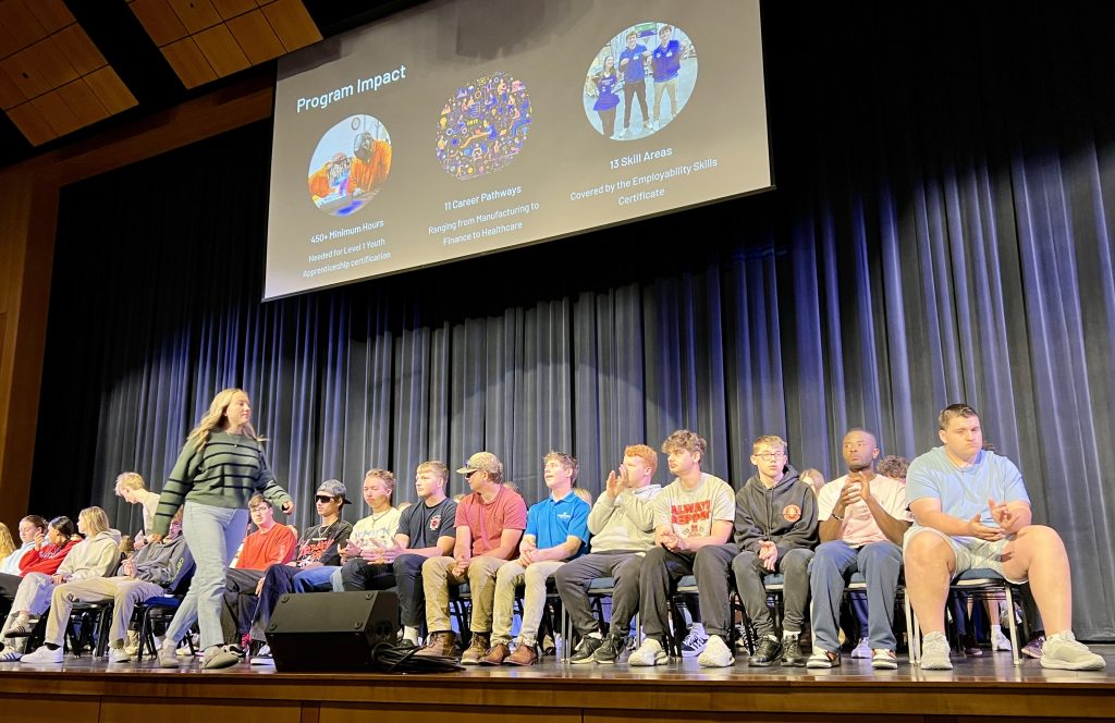 Picture of students sitting on stage.