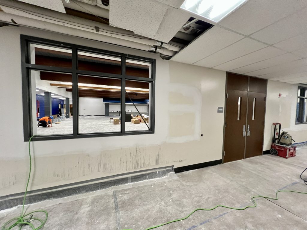 interior construction at templeton middle school. view of cafeteria being updated from hall.