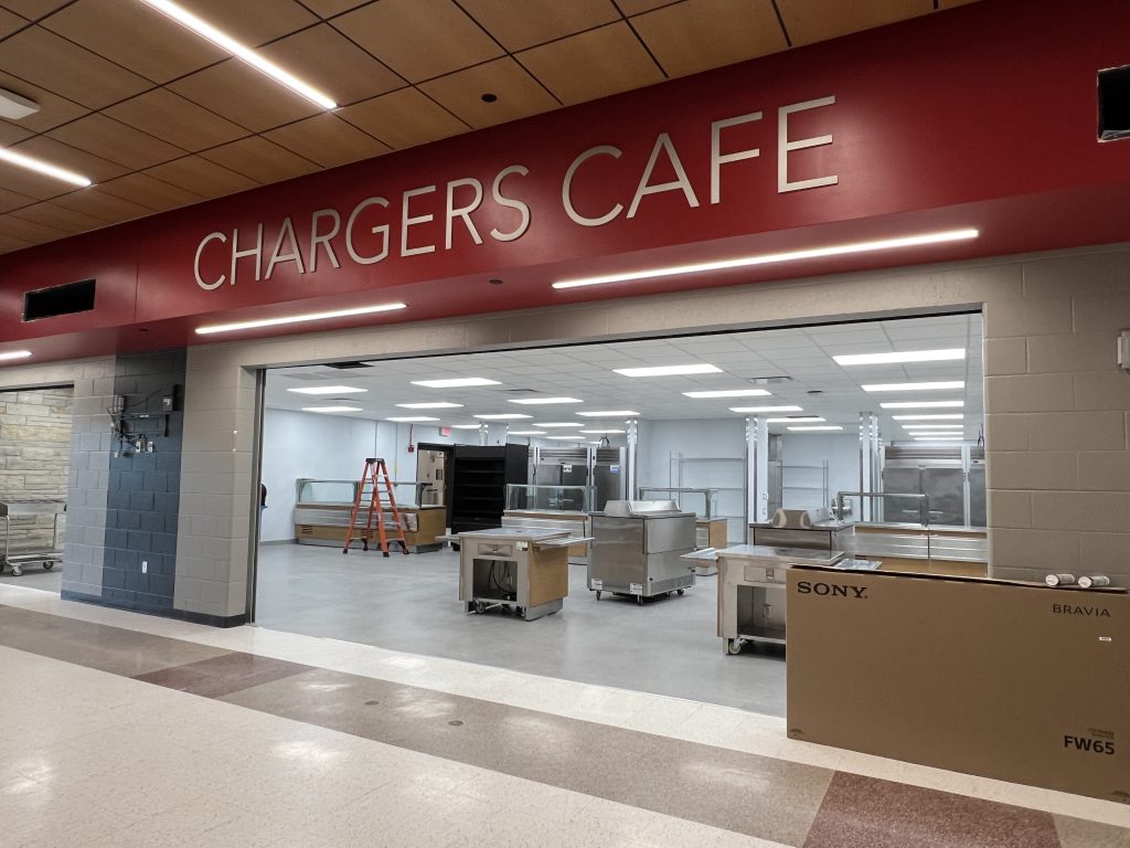 freshly painted chargers cafe sign. new kitchen area visible.