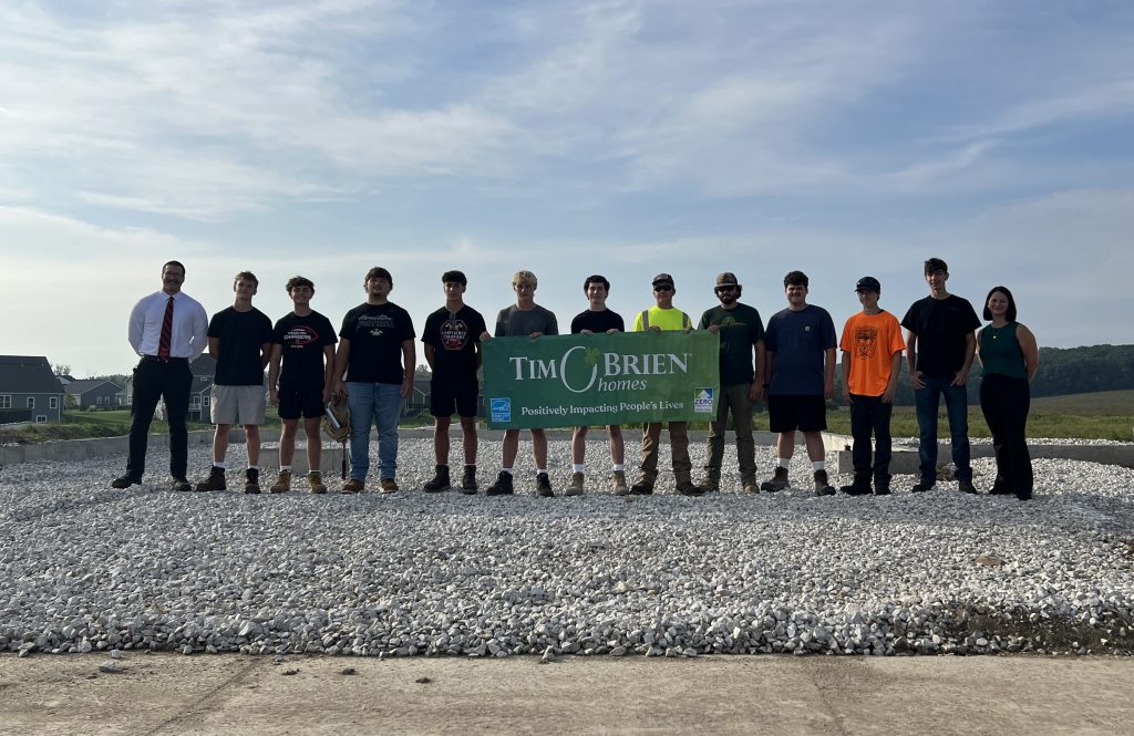 High School students standing at construction site
