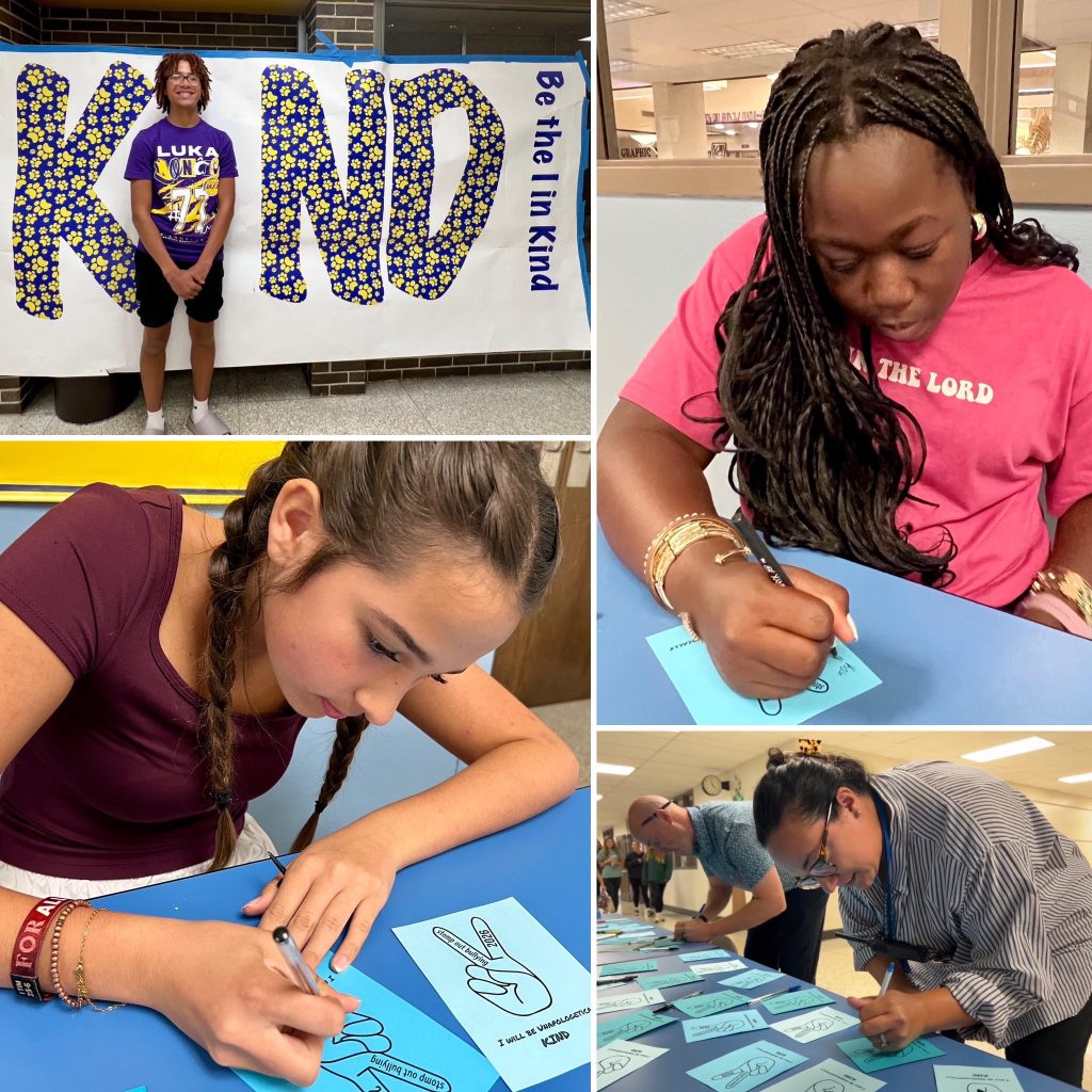 Four students and staff signing pledges to be kind.